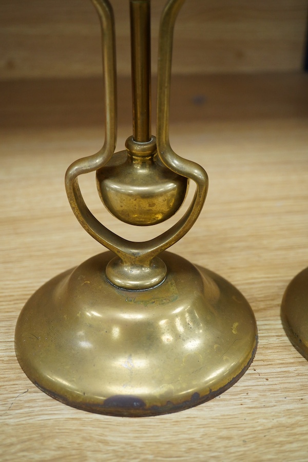 A pair of brass Pullman lamps with gimbal stems and Vaseline glass shades, modelled for wall mounting or freestanding, height to top of shade 40cm. Condition - good